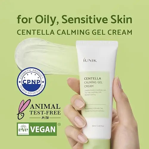 Hand holding a tube of iUNIK Centella Calming Gel Cream 60ml + iUNIK Centella Calming Daily Sunscreen 60ml with green background, highlighting suitability for oily, sensitive skin and vegan, animal test-free certification.