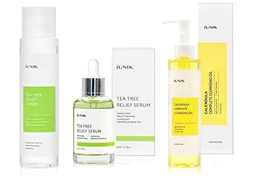 iUNIK Tea Tree Relief Toner 200ml, iUNIK Tea tree Relief Serum 50ml in bottle and box, and iUNIK Calendula Complete Cleansing Oil 200ml with pump and box displayed on white background