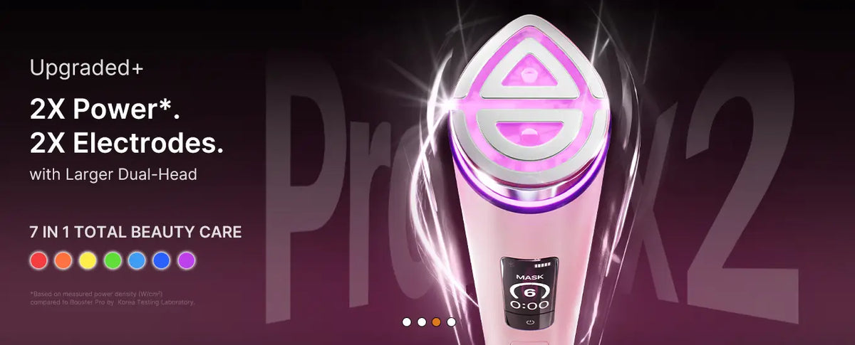 Medicube booster pro x2 pink and white facial device with glowing purple led lights for skincare treatment