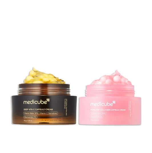 Open jars of medicube Deep Vitamin C Capsule Cream 55g in amber packaging with yellow capsules and PDRN Pink Collagen Capsule Cream 55g in pink packaging with pink capsules displayed side by side on white background.