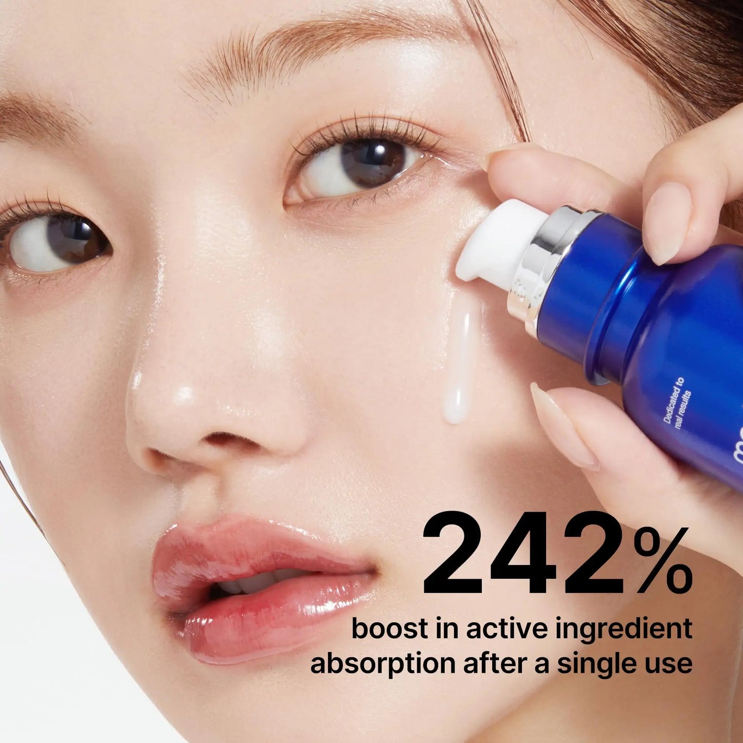 Close-up of a woman applying medicube Oneday Exosome Shot 7500 30ml 2pcs serum to her cheek, highlighting hydrating and brightening skincare benefits.