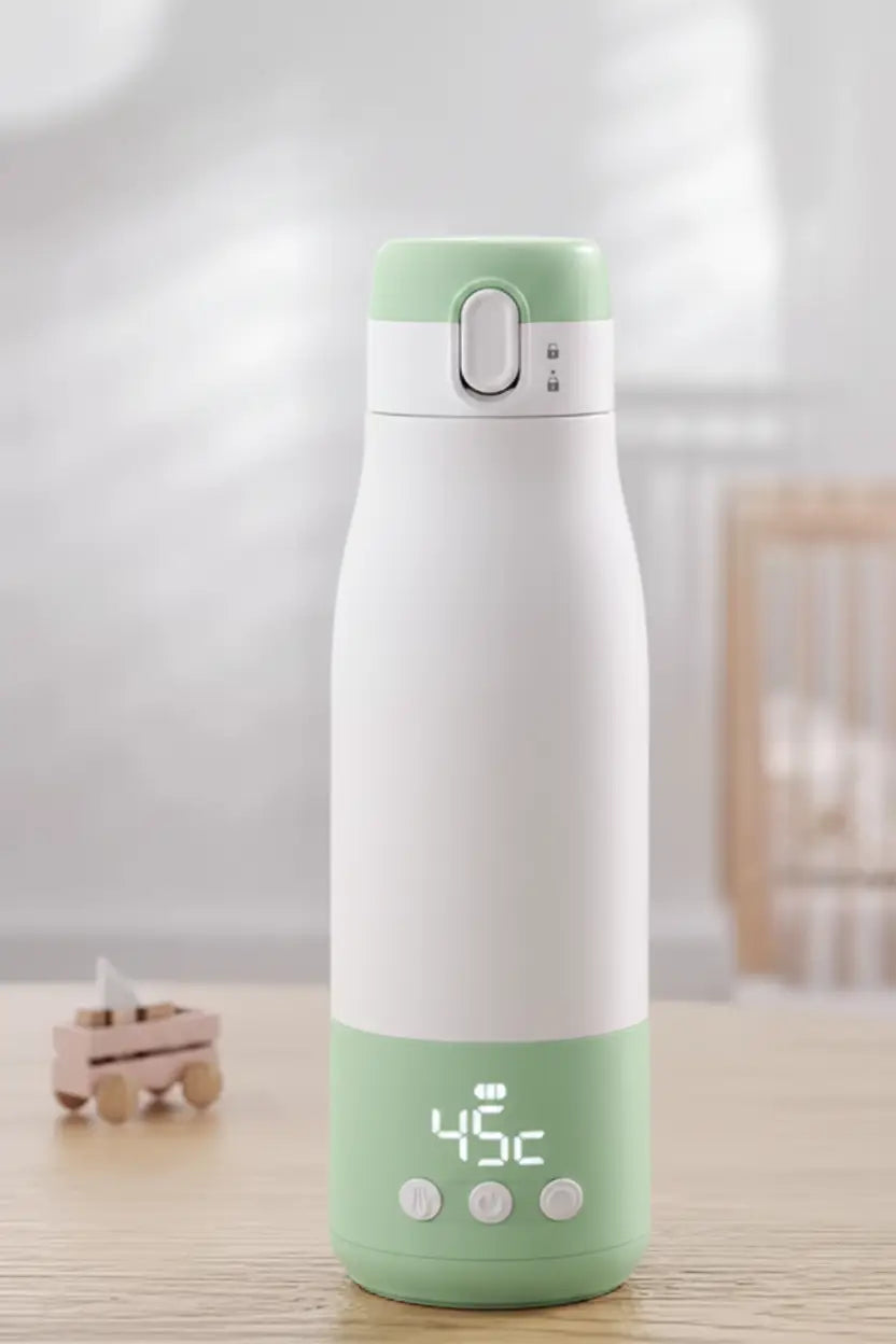 White and blue thermos with digital temperature display on a wooden surface.