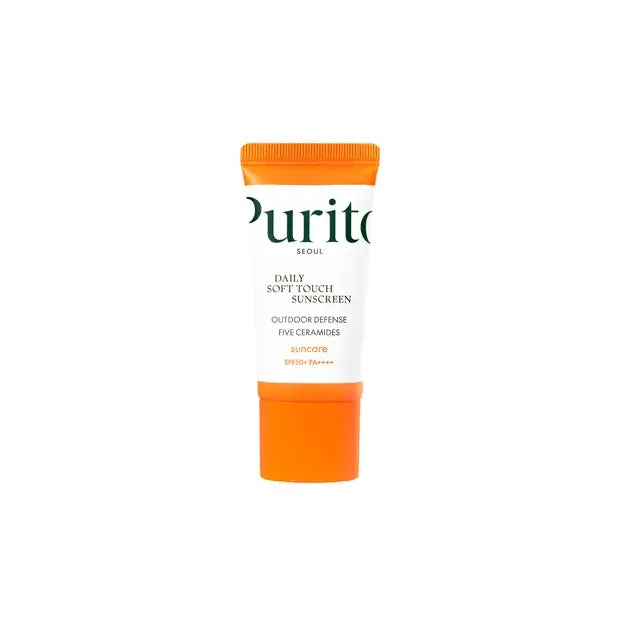 Tube of PURITO Daily Soft Touch Sunscreen with SPF50+ PA++++ featuring a white body and bright orange cap, designed for outdoor defense and skin care.