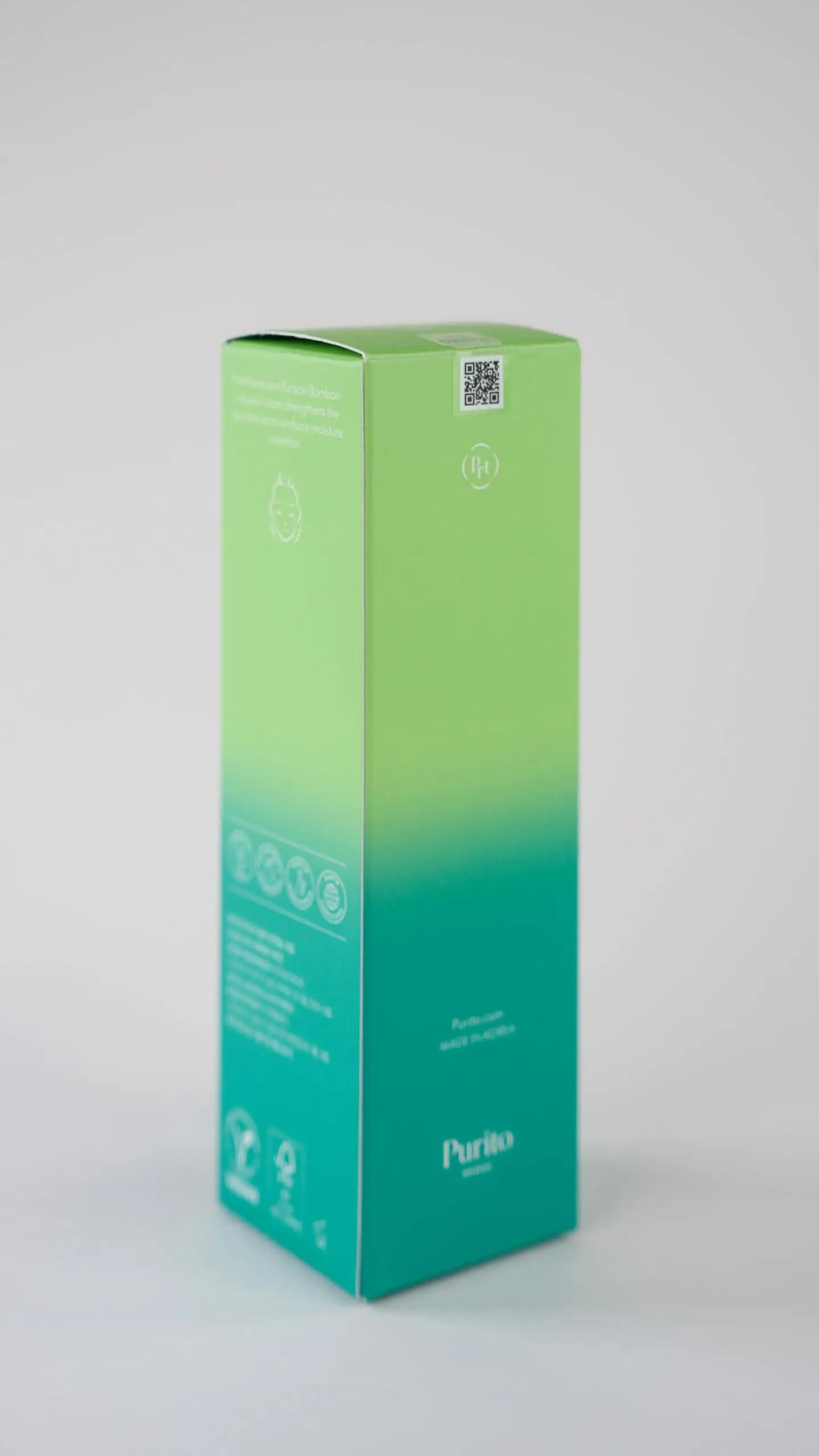 Packaging box with green to turquoise gradient color for PURITO Mighty Bamboo Panthenol Cream 100ml, featuring branding and product details for facial cream.