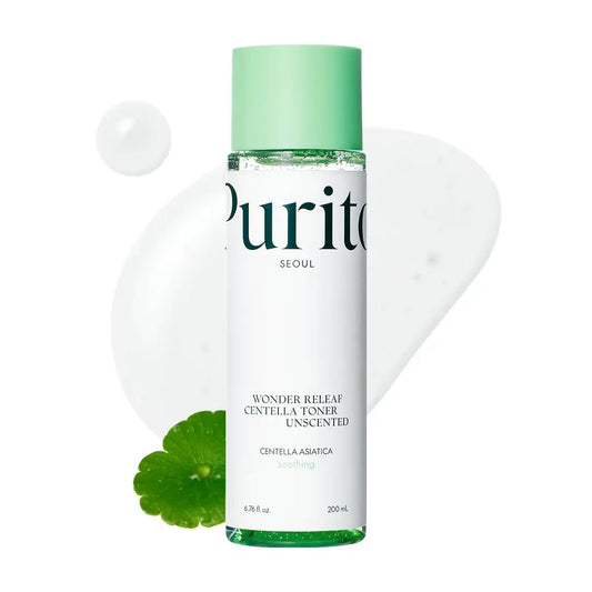 PURITO Seoul Wonder Releaf Centella Toner Unscented in a clear bottle with green cap, shown with centella leaf and transparent soothing toner drops in background.