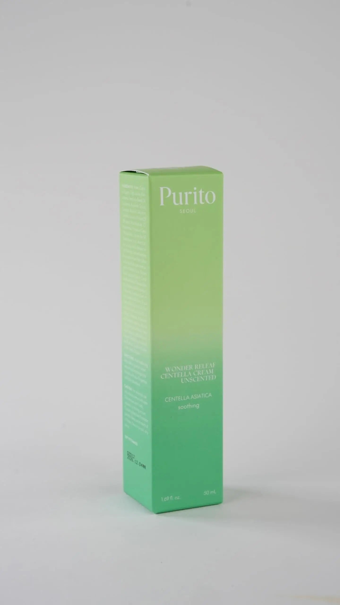 PURITO Wonder Releaf Centella Cream Unscented packaging in green gradient color with text highlighting centella asiatica and soothing properties for facial skincare.
