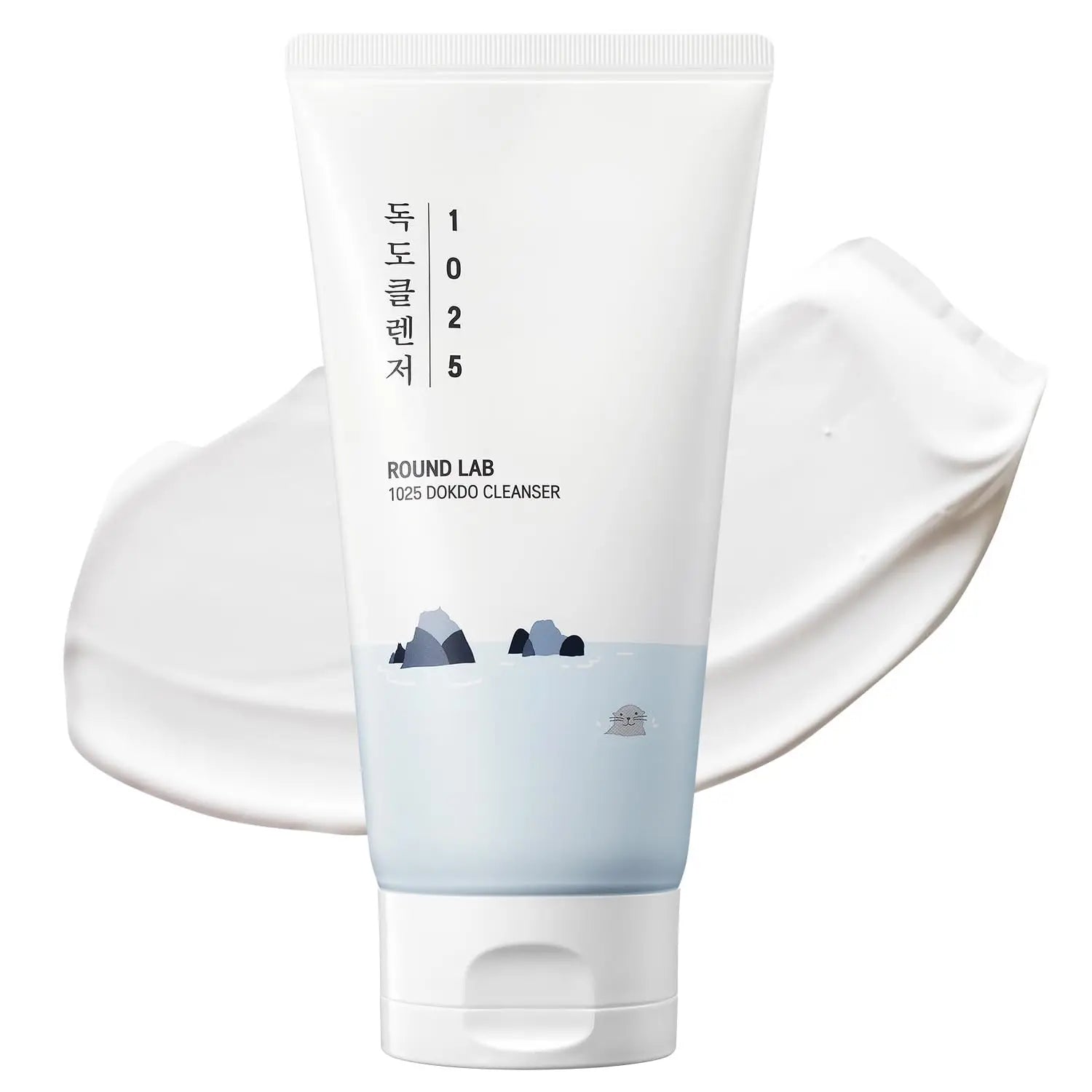 Tube of ROUND LAB 1025 Dokdo Cleanser 150ml with Korean text and subtle ocean rock illustration, placed over a smooth white cream texture background.