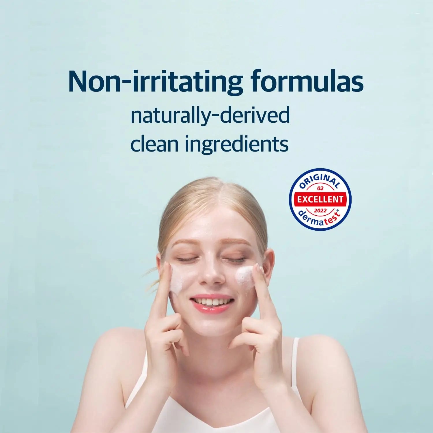 Woman gently applying ROUND LAB 1025 Dokdo Cleanser 150ml on her face with a smile, highlighting non-irritating formulas and naturally-derived clean ingredients.