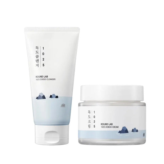 ROUND LAB 1025 Dokdo Cleanser 150ml + Dokdo Cream 80ml displayed with minimalist white and light blue packaging featuring a mountain and ocean design.