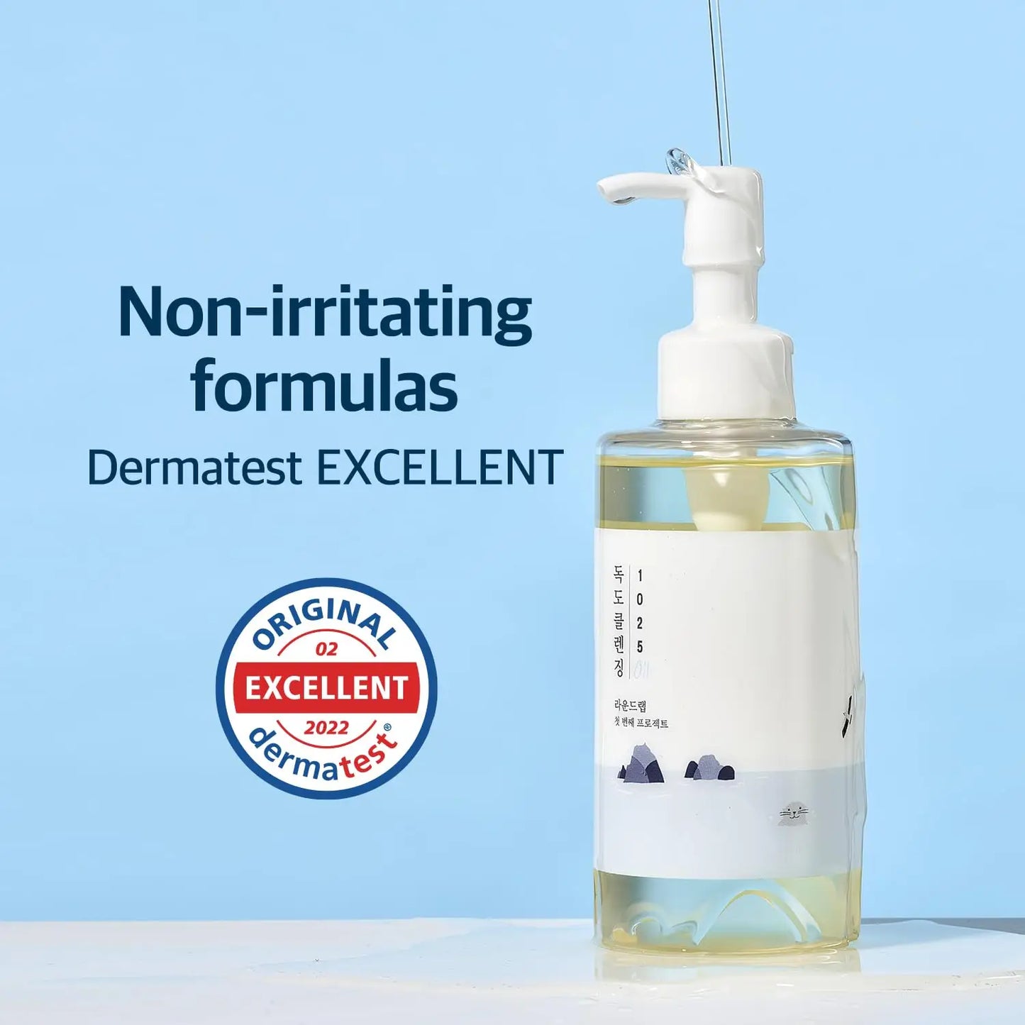 ROUND LAB 1025 Dokdo Cleansing Oil 200ml in a clear pump bottle, showcased with text highlighting non-irritating formulas and Dermatest Excellent certification.