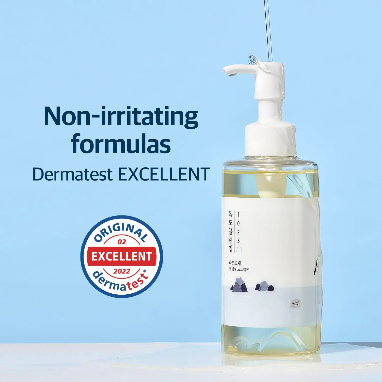 ROUND LAB 1025 Dokdo Cleansing Oil 200ml in a clear pump bottle, showcased with text highlighting non-irritating formulas and Dermatest Excellent certification.