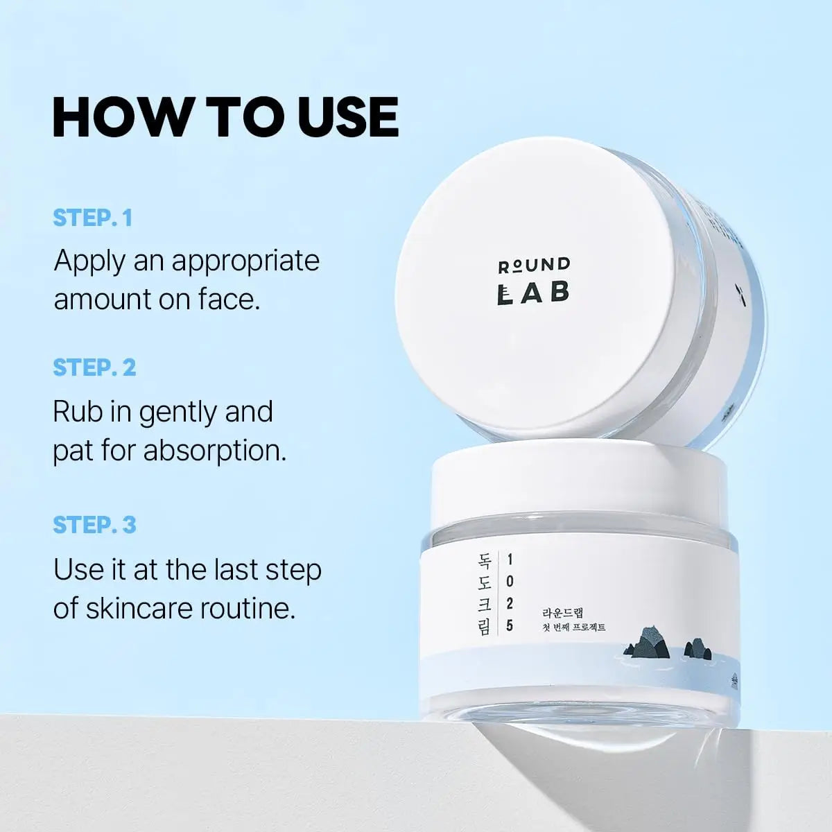 Jar of ROUND LAB 1025 DOKDO CREAM 80ml with instructions on how to use: apply an appropriate amount on face, rub gently, and use as the last step in skincare routine against a light blue background.