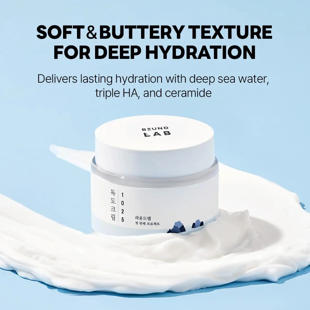 ROUND LAB 1025 DOKDO CREAM 80ml in a white jar displayed on creamy texture, highlighting soft and buttery formula for deep hydration with deep sea water, triple HA, and ceramide.