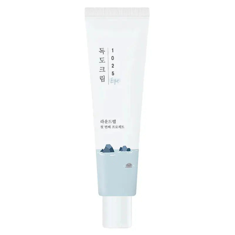 Tube of Round Lab 1025 Dokdo Eye cream 30ml with white and light blue packaging featuring a minimalist design and small rock illustrations at the bottom.