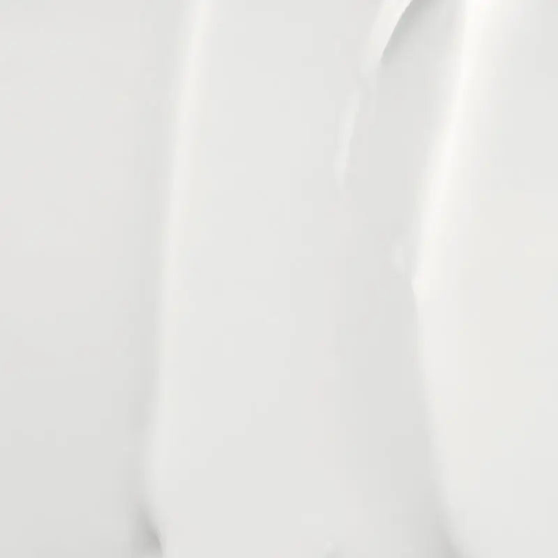 Clear smooth white cream texture close-up for Round Lab 1025 Dokdo Eye cream 30ml, highlighting its lightweight moisturizing consistency for delicate skin application.