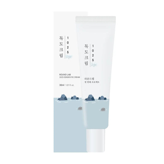 Round Lab 1025 Dokdo Eye cream 30ml in a white and light blue tube with minimalist mountain and water design, accompanied by matching packaging box.