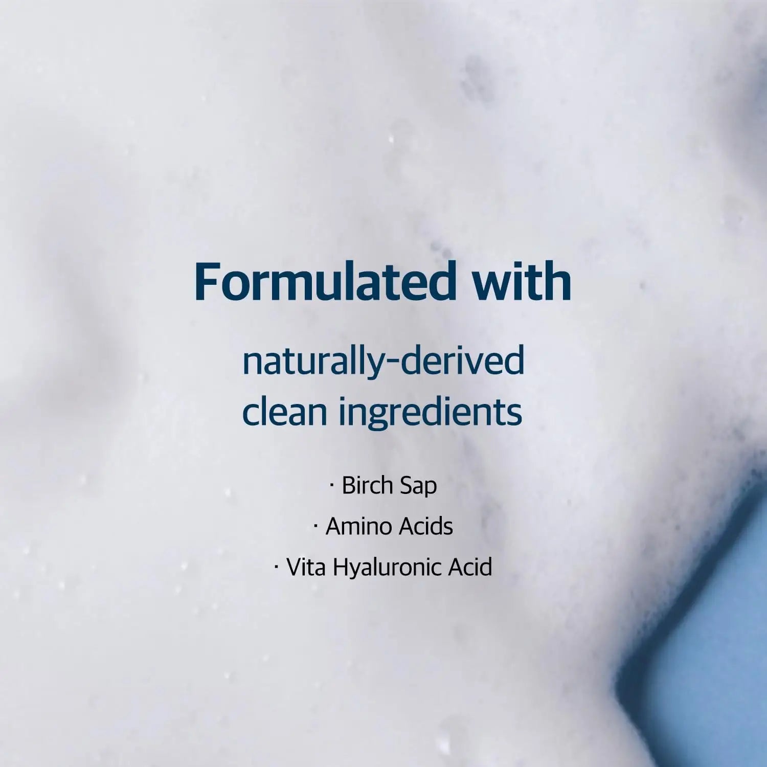 Text highlighting that ROUND LAB Birch Juice Moisturizing Cleanser 150ml is formulated with naturally-derived clean ingredients including birch sap, amino acids, and vita hyaluronic acid on a foamy white background.