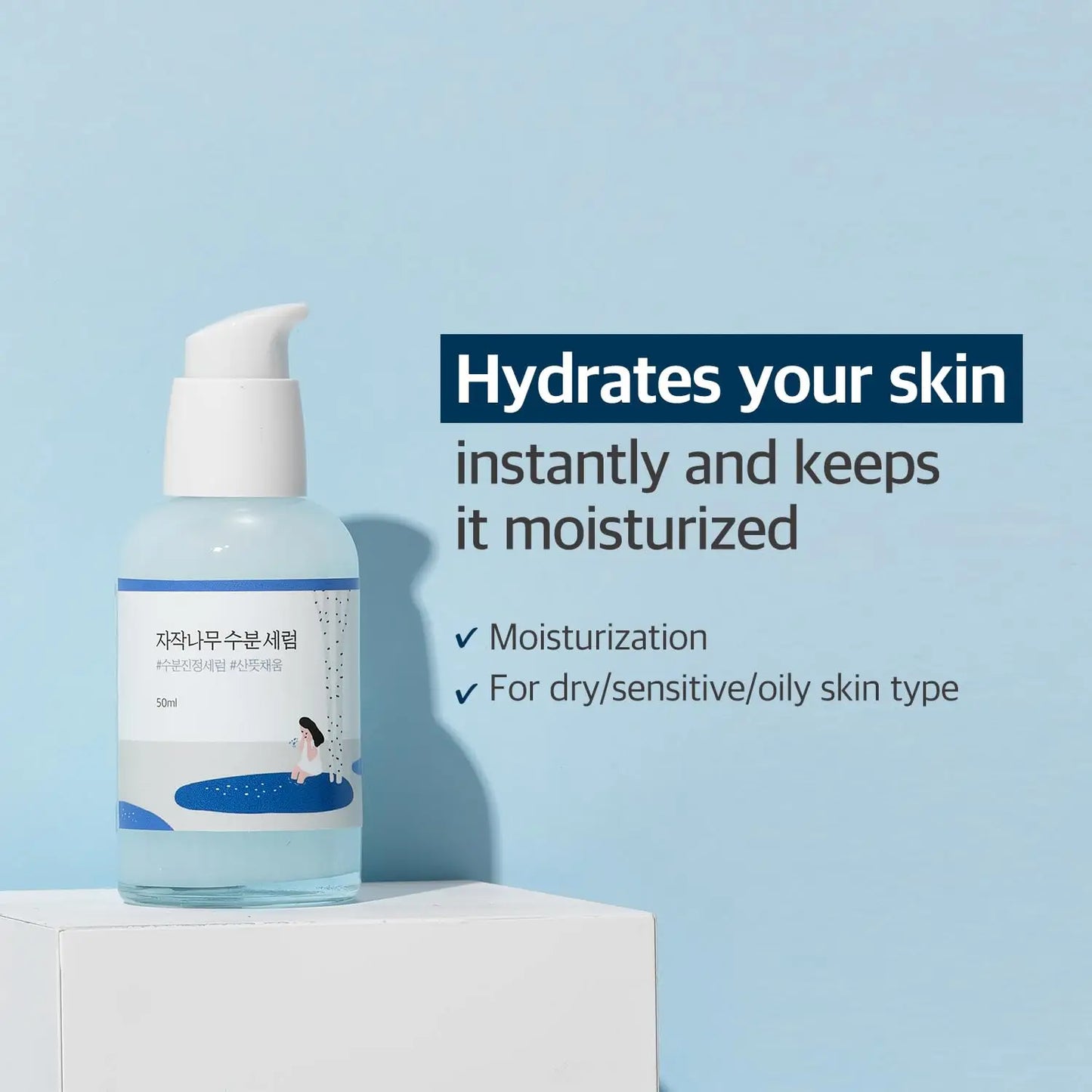 ROUND LAB Birch Juice Moisturizing Serum (50 ml) bottle with pump on a white pedestal, featuring text about hydration and suitability for dry, sensitive, and oily skin types against a light blue background.