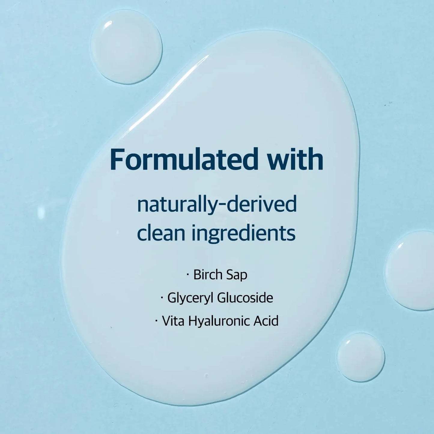 Close-up of clear serum droplets on a light blue surface with text highlighting that ROUND LAB Birch Juice Moisturizing Serum (50 ml) is formulated with naturally-derived clean ingredients including birch sap, glyceryl glucoside, and vita hyaluronic acid.