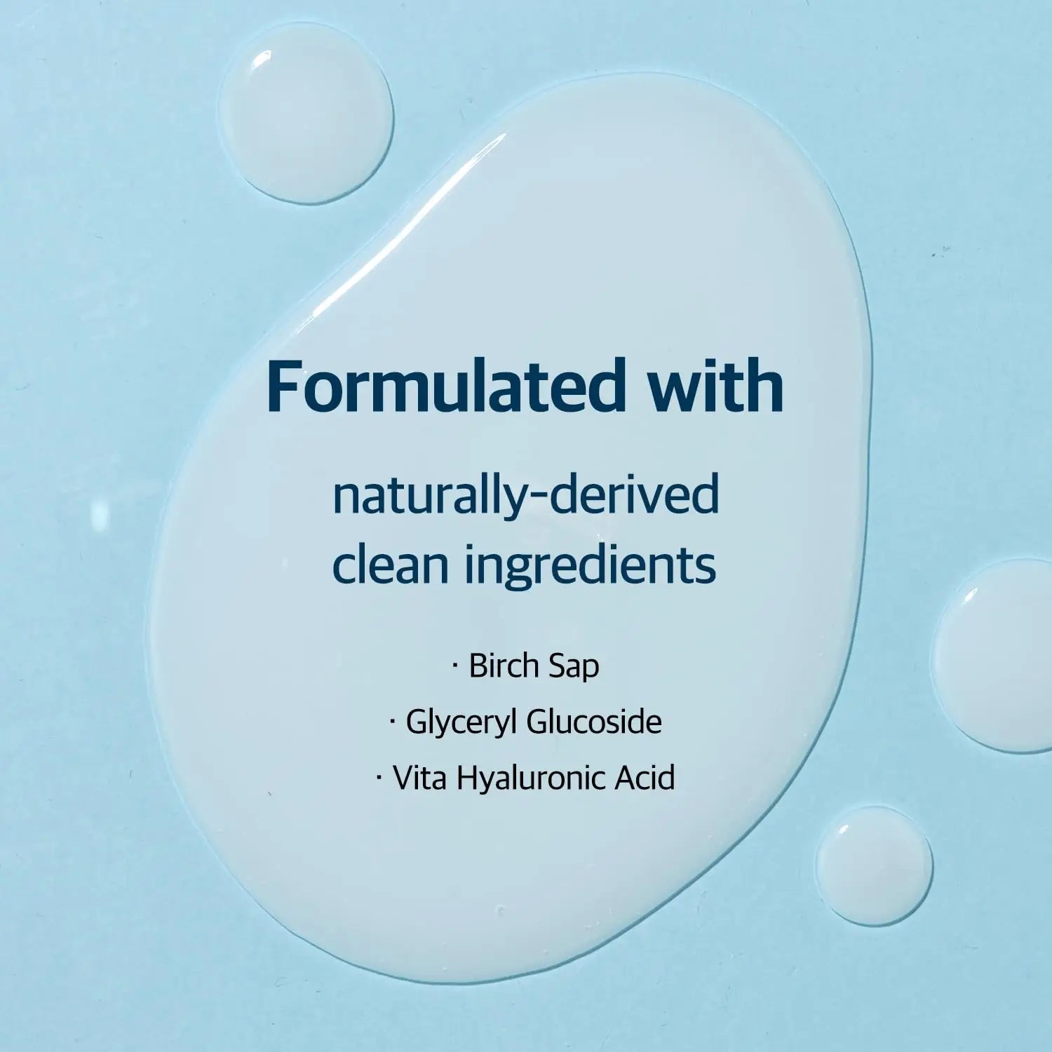 Close-up of clear serum droplets on a light blue surface with text highlighting that ROUND LAB Birch Juice Moisturizing Serum (50 ml) is formulated with naturally-derived clean ingredients including birch sap, glyceryl glucoside, and vita hyaluronic acid.