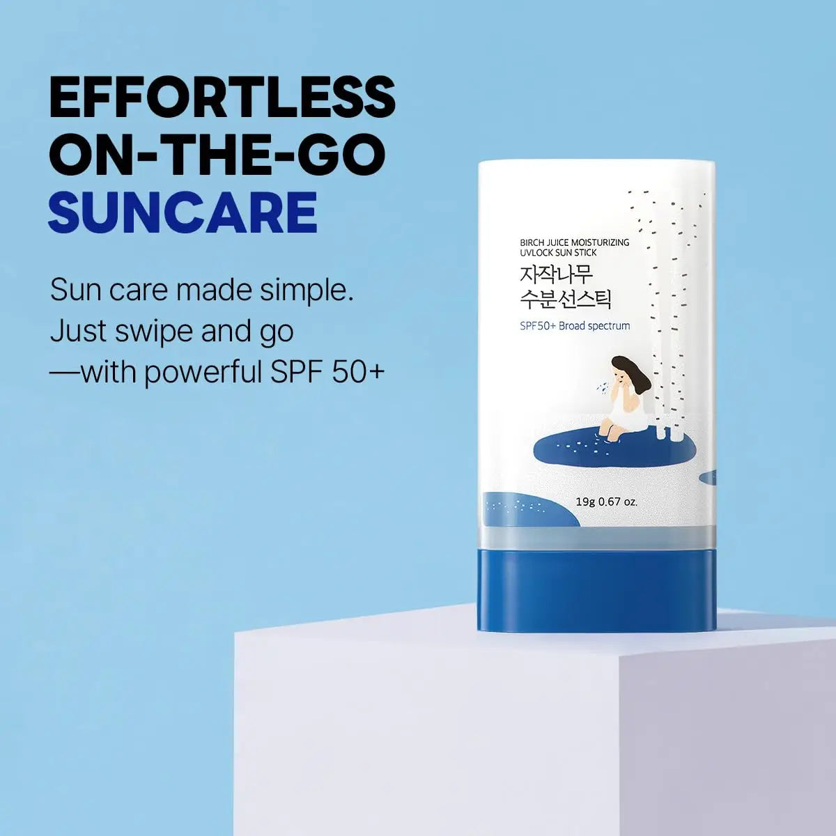 ROUND LAB Birch Juice Moisturizing Sun Stick 19g standing on a white pedestal against a blue background with text highlighting effortless on-the-go suncare and SPF 50+ protection.