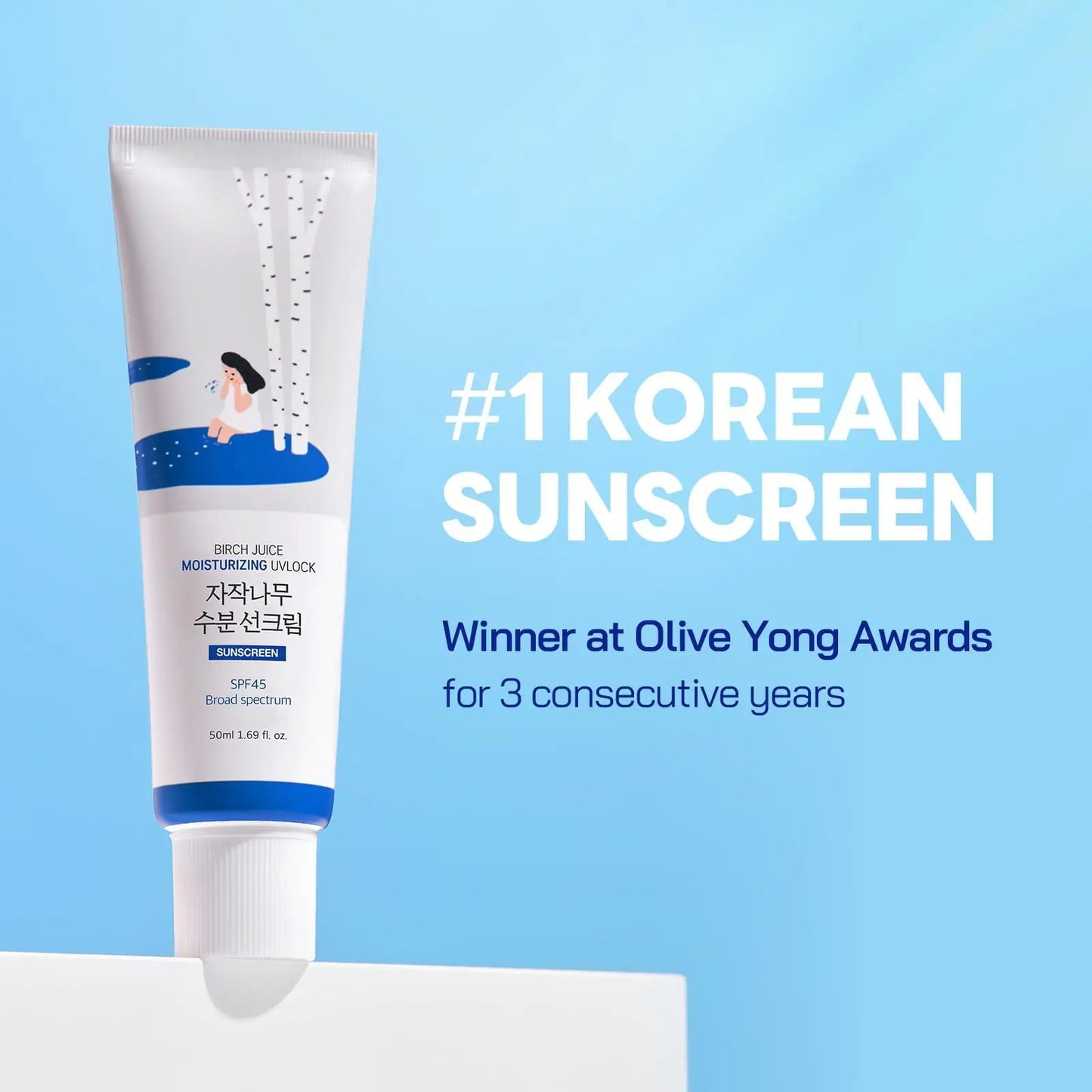 ROUND LAB Birch Juice Moisturizing Sunscreen 50ml in a white and blue tube with birch tree illustrations, displayed against a light blue background promoting it as a top Korean sunscreen.