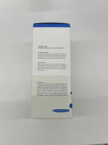 White and blue packaging of ROUND LAB Birch Juice Moisturizing Toner 300ml showing product description and usage instructions in French on the back.