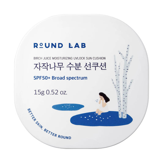 Round Lab Birch Juice Moisturizing UVLock Sun Cushion 15g compact with SPF50+ broad spectrum protection and minimalist design featuring birch tree illustration.
