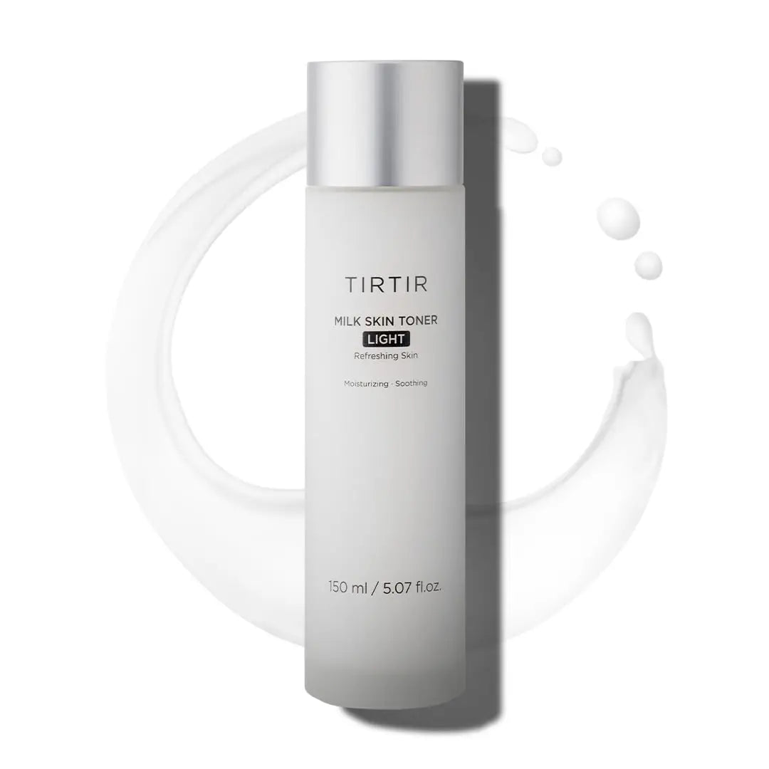 TIRTIR Milk Skin Rice Toner Light 150ml in a sleek frosted bottle with silver cap, surrounded by a smooth splash of milky toner for moisturizing and soothing skin.