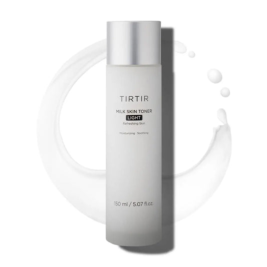 TIRTIR Milk Skin Rice Toner Light 150ml in a sleek frosted bottle with silver cap, surrounded by a smooth splash of milky toner for moisturizing and soothing skin.