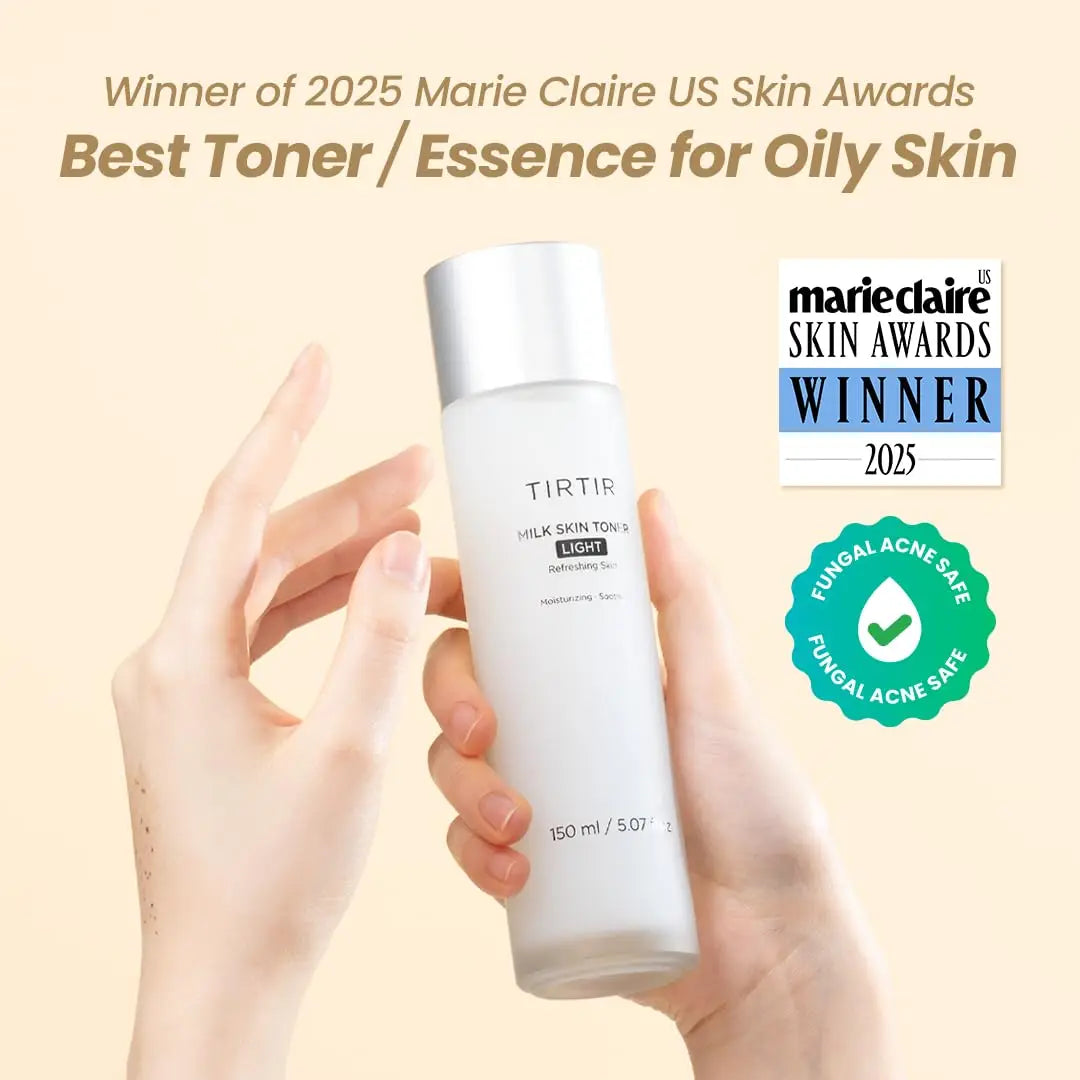 Hand holding a white bottle of TIRTIR Milk Skin Rice Toner Light 150ml with text highlighting its 2025 Marie Claire US Skin Awards win for best toner and fungal acne safety.