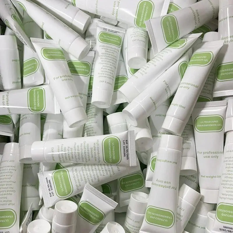 Multiple white tubes labeled Ultrasound Transmission Gel for Fetal Dopplers diagnostic and ultrasound devices 30ml, stacked together, designed for professional medical use.